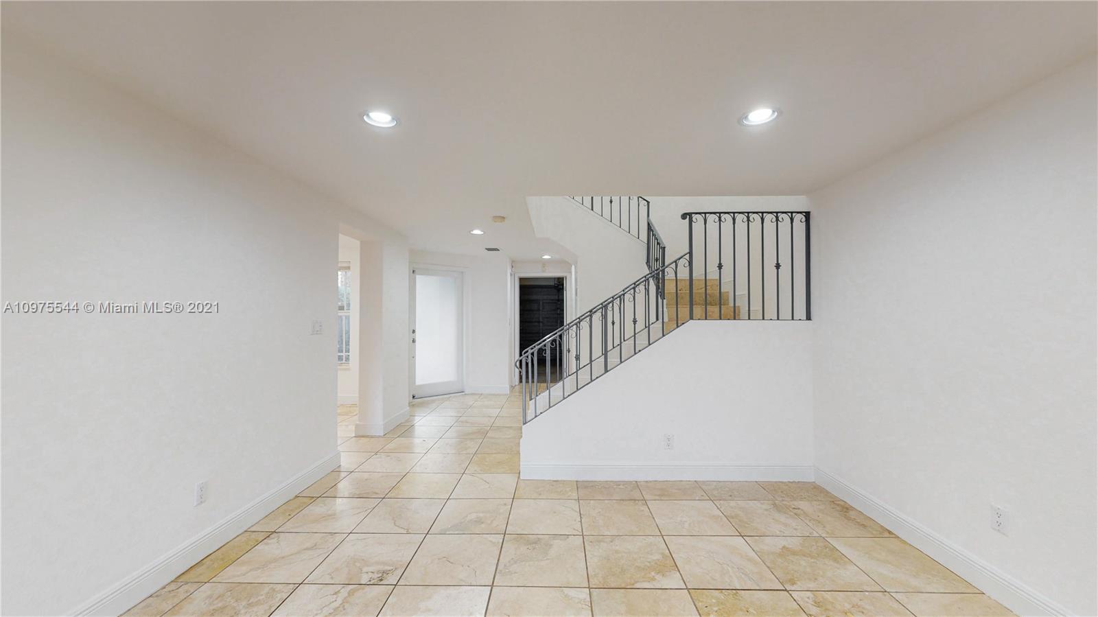 3088 Mary Street, Unit 2 Miami, FL 33133 - Photo 7 of 35 a view of a hallway with entryway and stairs