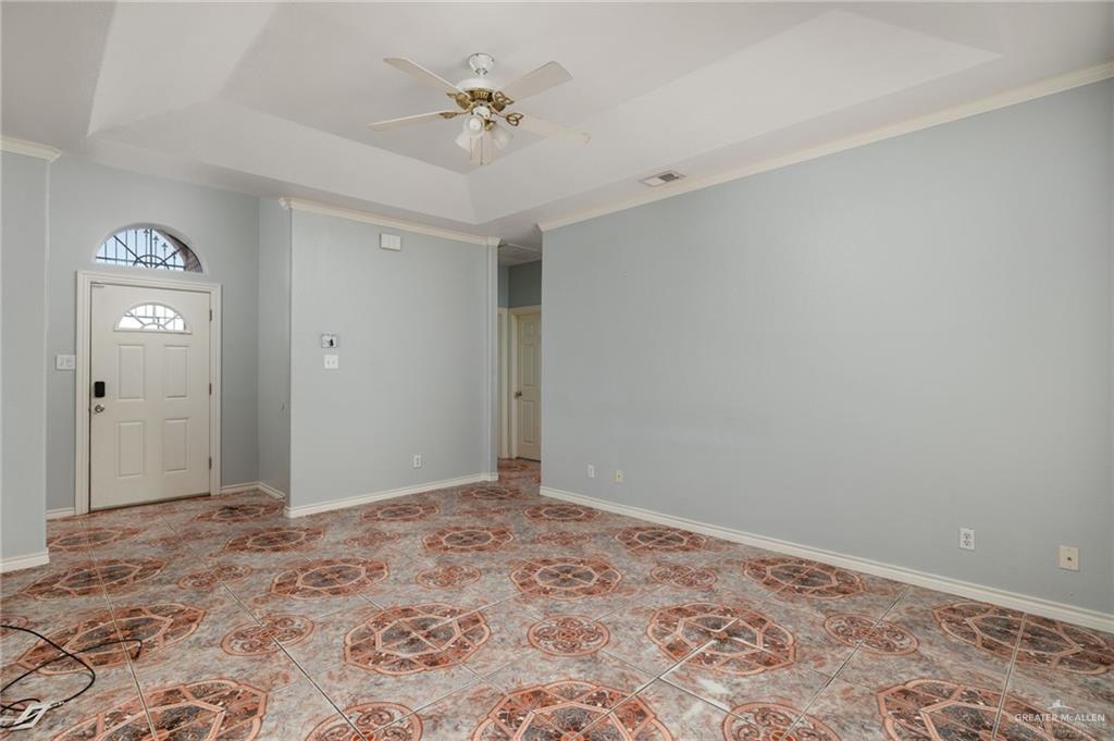2015 North Ruby Street Edinburg, TX 78541 - Photo 2 of 11 a view of a hallway with a chandelier fan