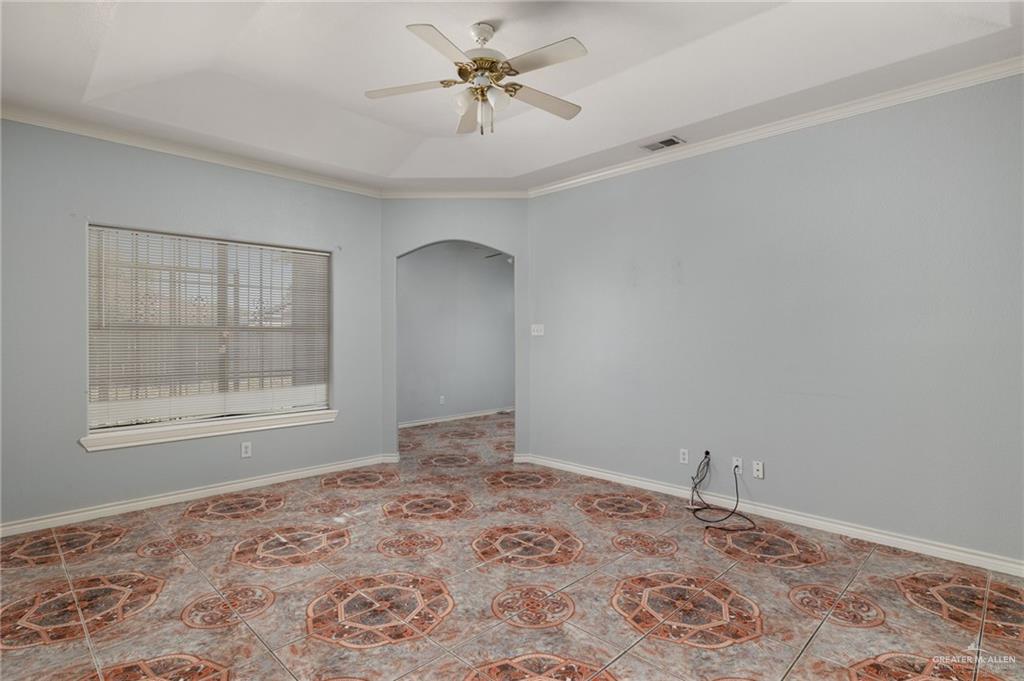 2015 North Ruby Street Edinburg, TX 78541 - Photo 3 of 11 a view of a big room with windows and chandelier fan