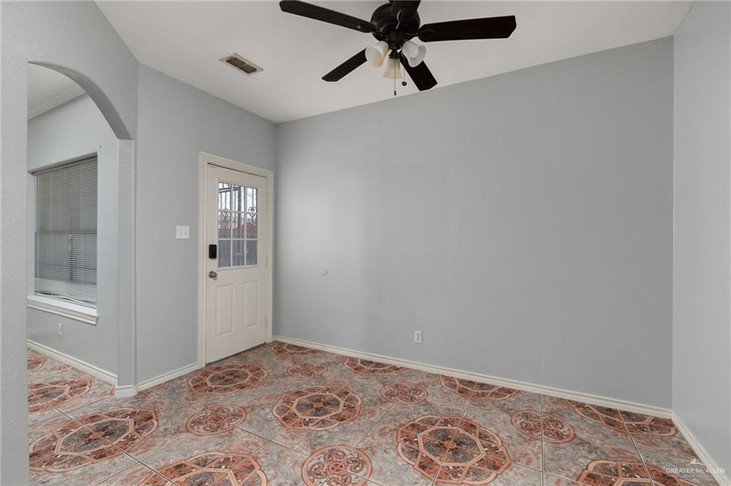 2015 North Ruby Street Edinburg, TX 78541 - Photo 4 of 11 a view of a hallway with a chandelier fan and closet in a room