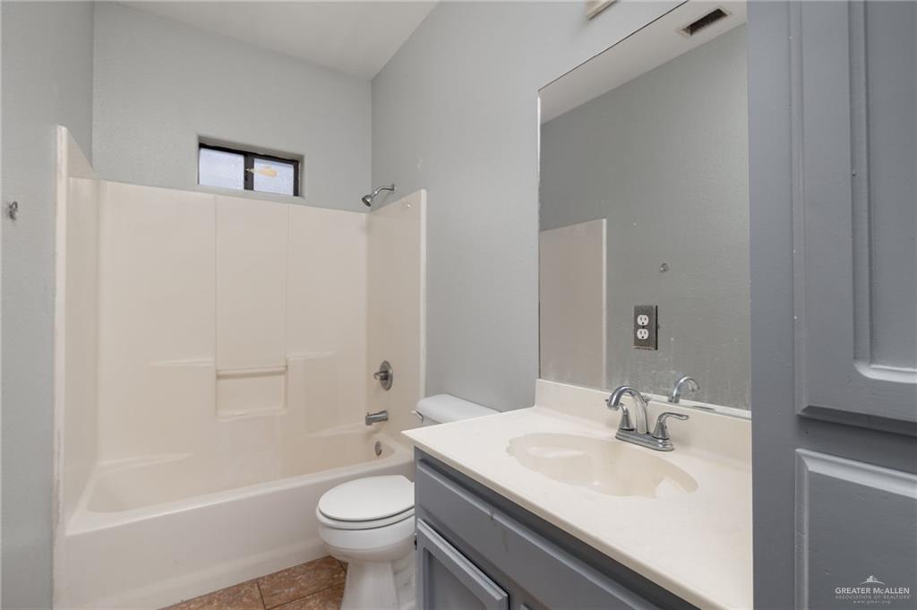 2015 North Ruby Street Edinburg, TX 78541 - Photo 10 of 11 a bathroom with a sink a toilet and shower