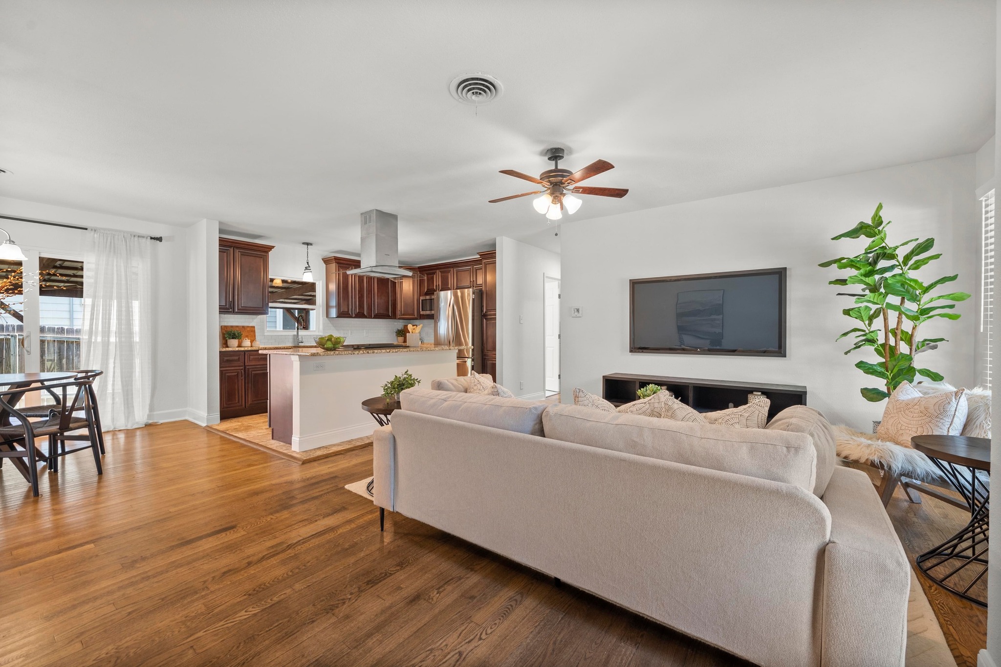 2640 West 45th Street Austin, TX 78731 - Photo 4 of 34 Living room featuring plenty of natural light, a ceiling fan, and light wood-style floors