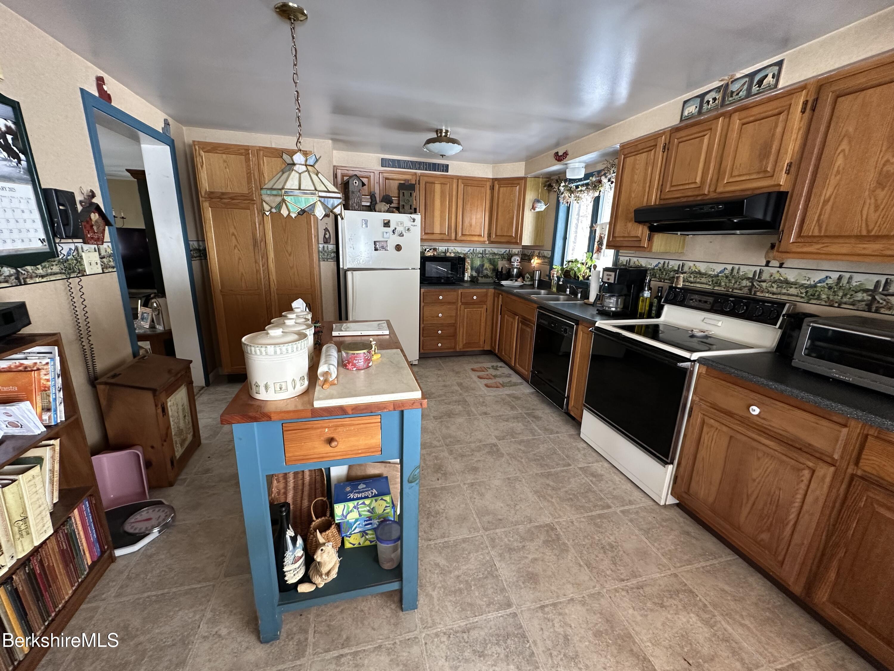 1020 Fairview Street Lee, MA 01238 - Photo 11 of 27 a kitchen with stainless steel appliances granite countertop a sink stove and refrigerator