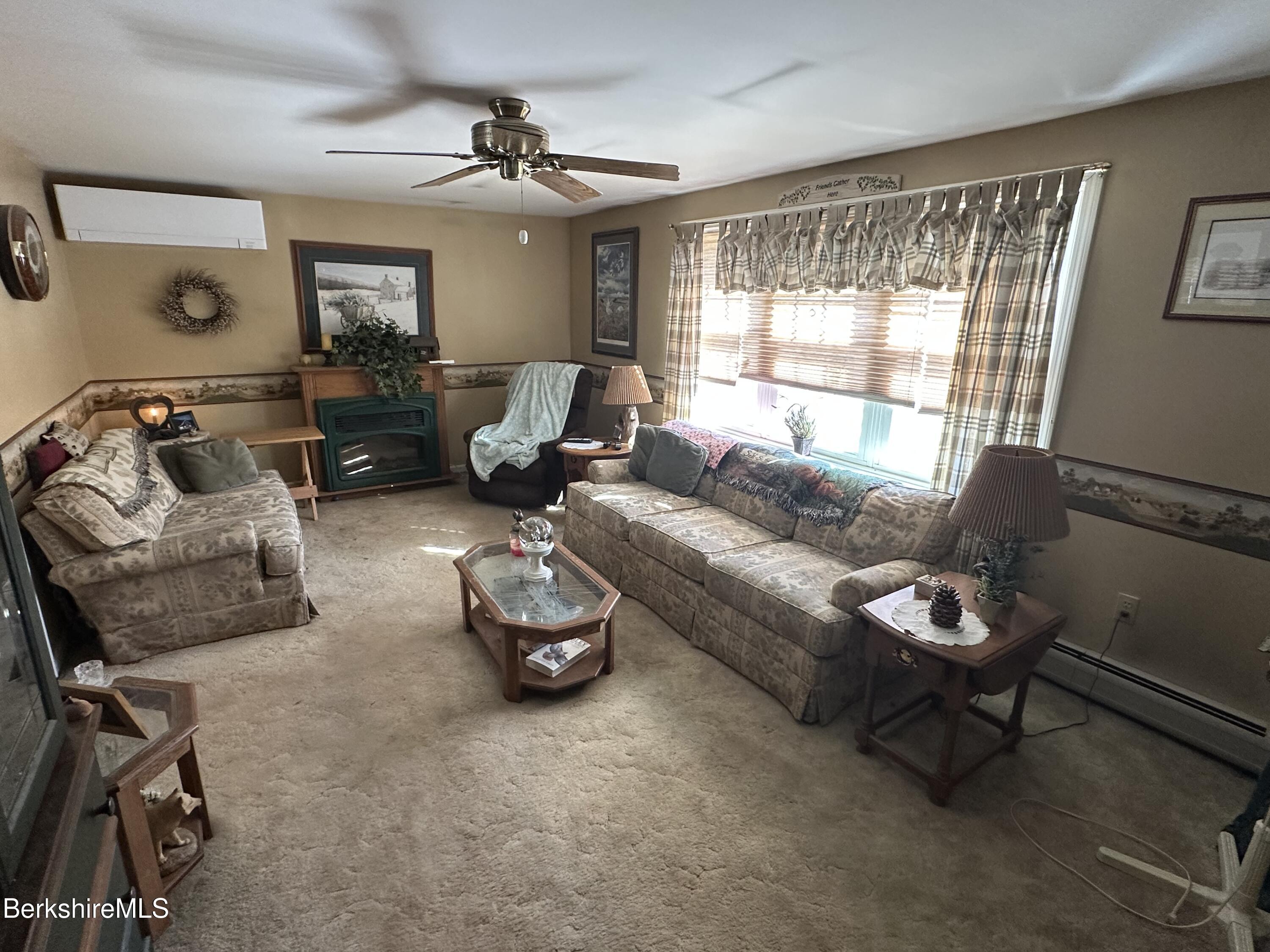 1020 Fairview Street Lee, MA 01238 - Photo 12 of 27 a living room with furniture a air conditioner and a window