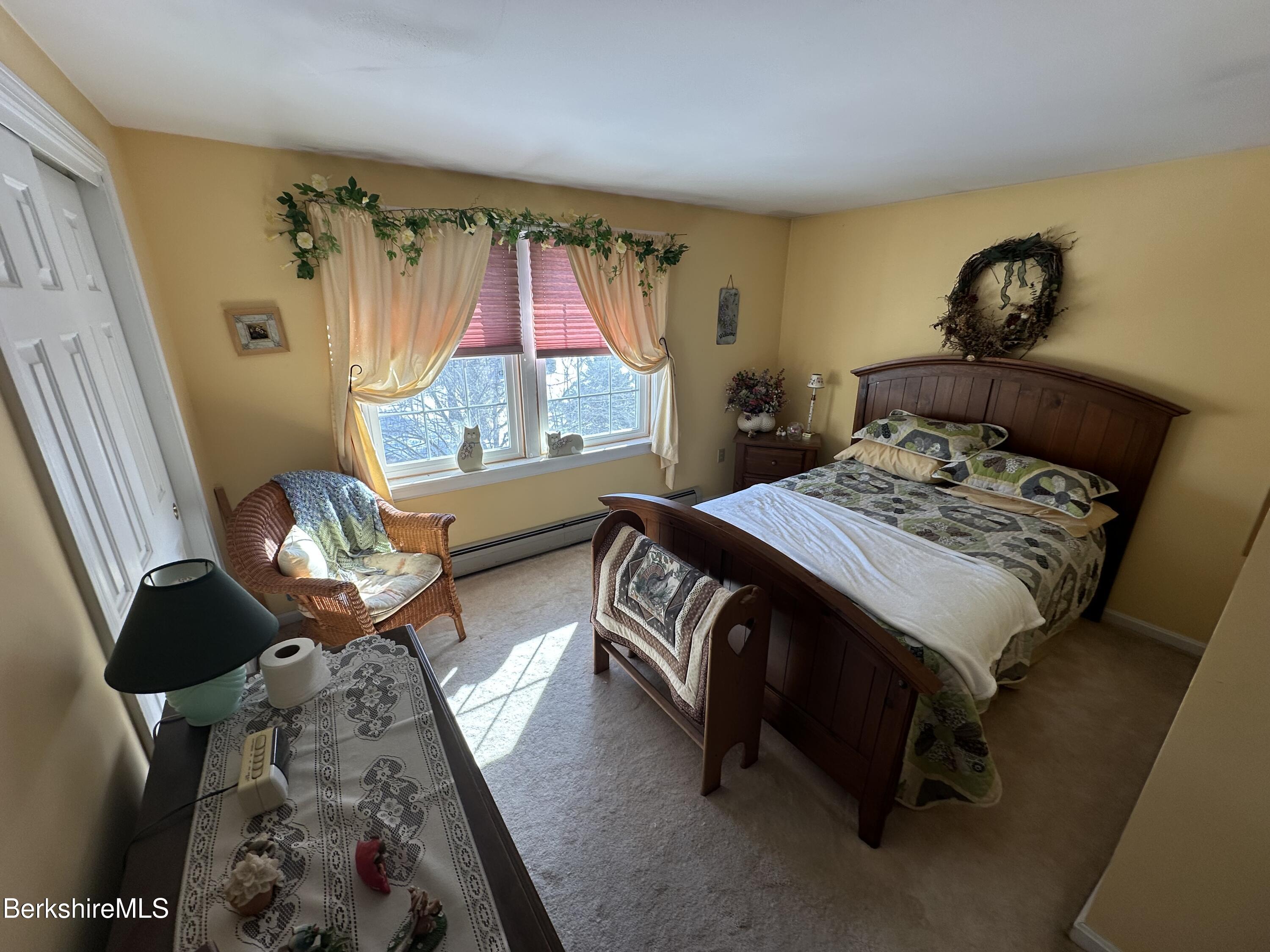 1020 Fairview Street Lee, MA 01238 - Photo 15 of 27 a bedroom with a bed and wooden floor