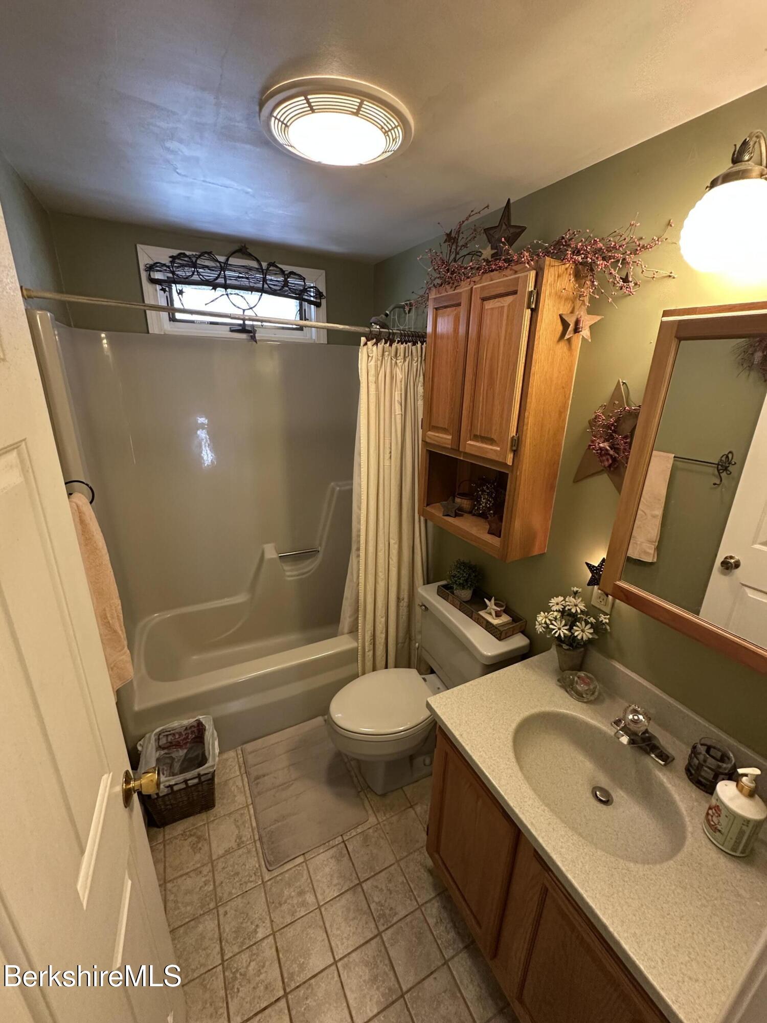 1020 Fairview Street Lee, MA 01238 - Photo 17 of 27 a bathroom with a sink toilet and shower