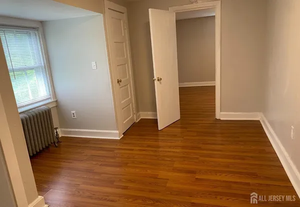 a view of wooden floor in an empty room