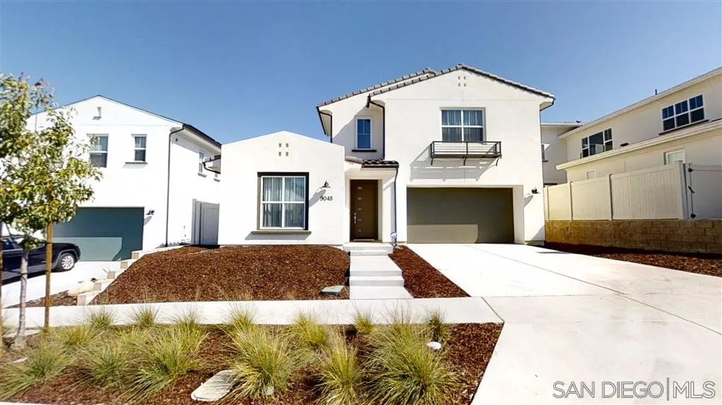 9048 West Bluff Place Santee, CA 92071 - Photo 1 of 14 a front view of a house with a yard