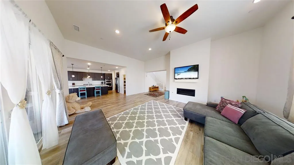9048 West Bluff Place Santee, CA 92071 - Photo 6 of 14 a living room with furniture and a flat screen tv