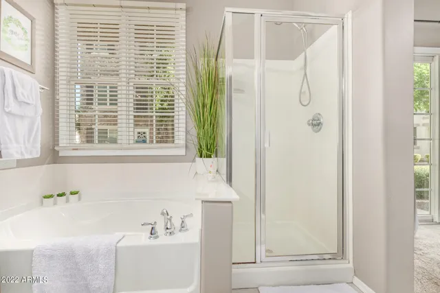 a bathroom with a bathtub and a sink