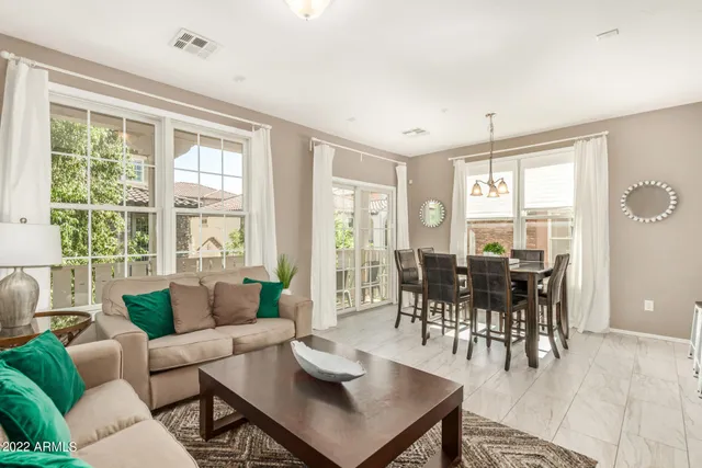 a dining room with furniture wooden floor and a rug