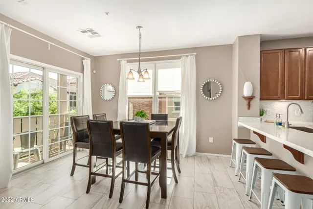 a view of a dining room with furniture window and outside view