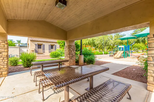 a view of a patio with a table chairs and a patio
