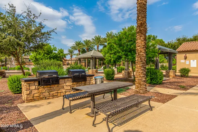 a swimming pool with outdoor seating and yard