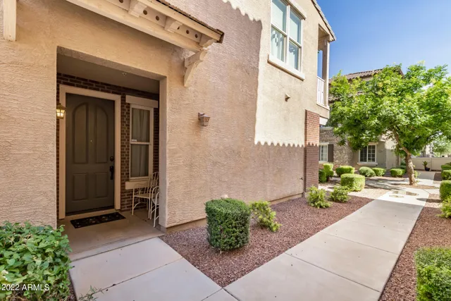 a view of a building with potted plants