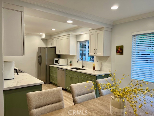 389 Cliff Drive, Unit 8 Pasadena, CA 91107 - Photo 5 of 16 a kitchen with stainless steel appliances kitchen island granite countertop a sink and cabinets