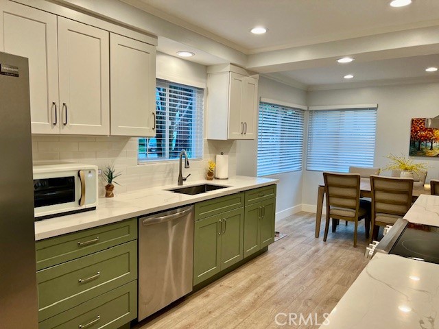389 Cliff Drive, Unit 8 Pasadena, CA 91107 - Photo 6 of 16 a kitchen with a sink cabinets and window