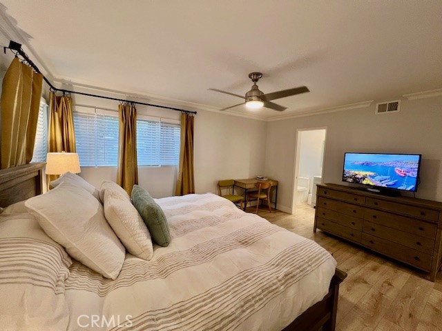 389 Cliff Drive, Unit 8 Pasadena, CA 91107 - Photo 10 of 16 a bedroom with a bed and a flat screen tv