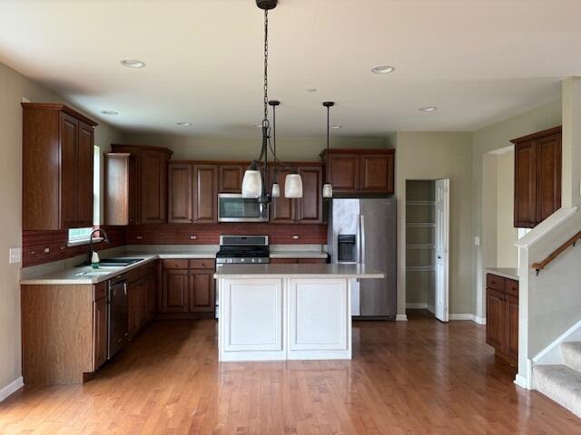 175 Owen Street Matteson, IL 60443 - Photo 11 of 26 a kitchen with stainless steel appliances kitchen island granite countertop a sink stove and refrigerator