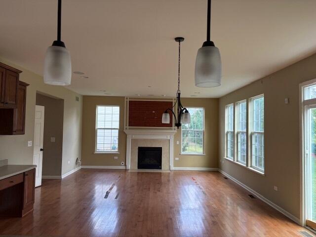 175 Owen Street Matteson, IL 60443 - Photo 12 of 26 a view of an empty room with wooden floor fireplace and a window