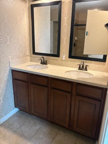 a bathroom with a glass shower door