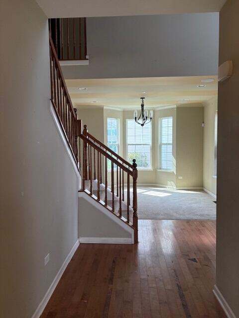 175 Owen Street Matteson, IL 60443 - Photo 5 of 26 a view of staircase with wooden floor and fan