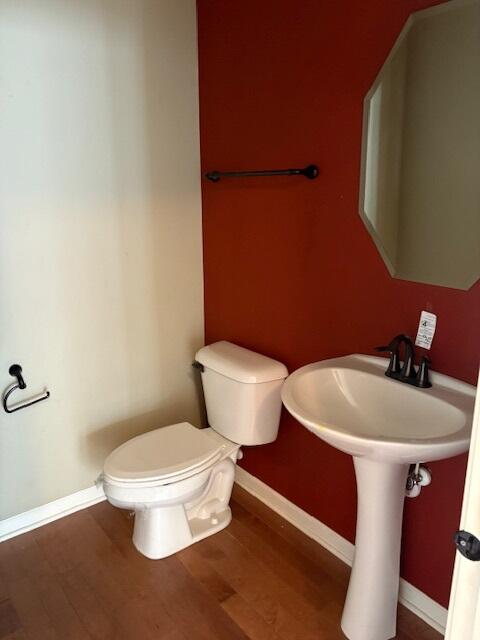 175 Owen Street Matteson, IL 60443 - Photo 6 of 26 a white toilet sitting next to a bathroom sink