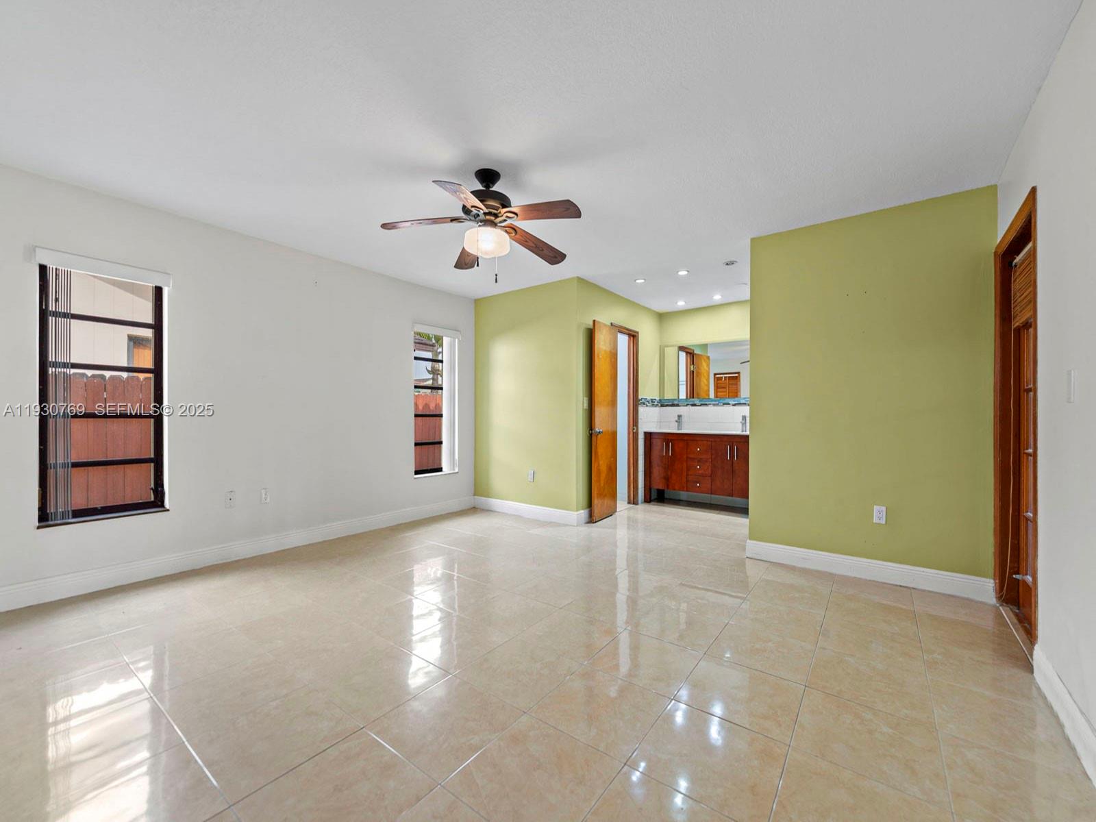 3791 Southwest 142nd Avenue Miami, FL 33175 - Photo 11 of 44 a view of a livingroom with a furniture and chandelier fan