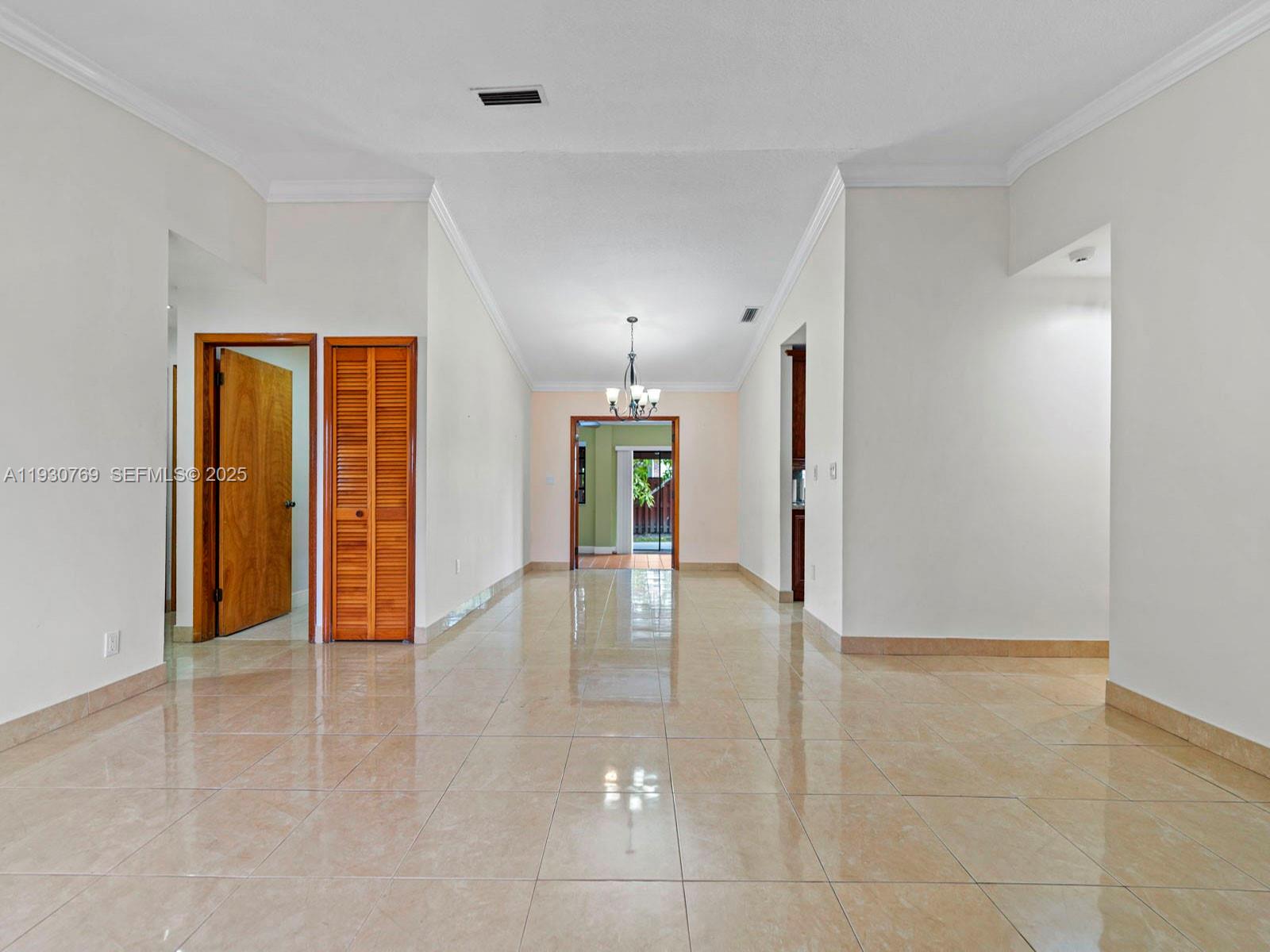 3791 Southwest 142nd Avenue Miami, FL 33175 - Photo 12 of 44 wooden floor in an empty room with a window