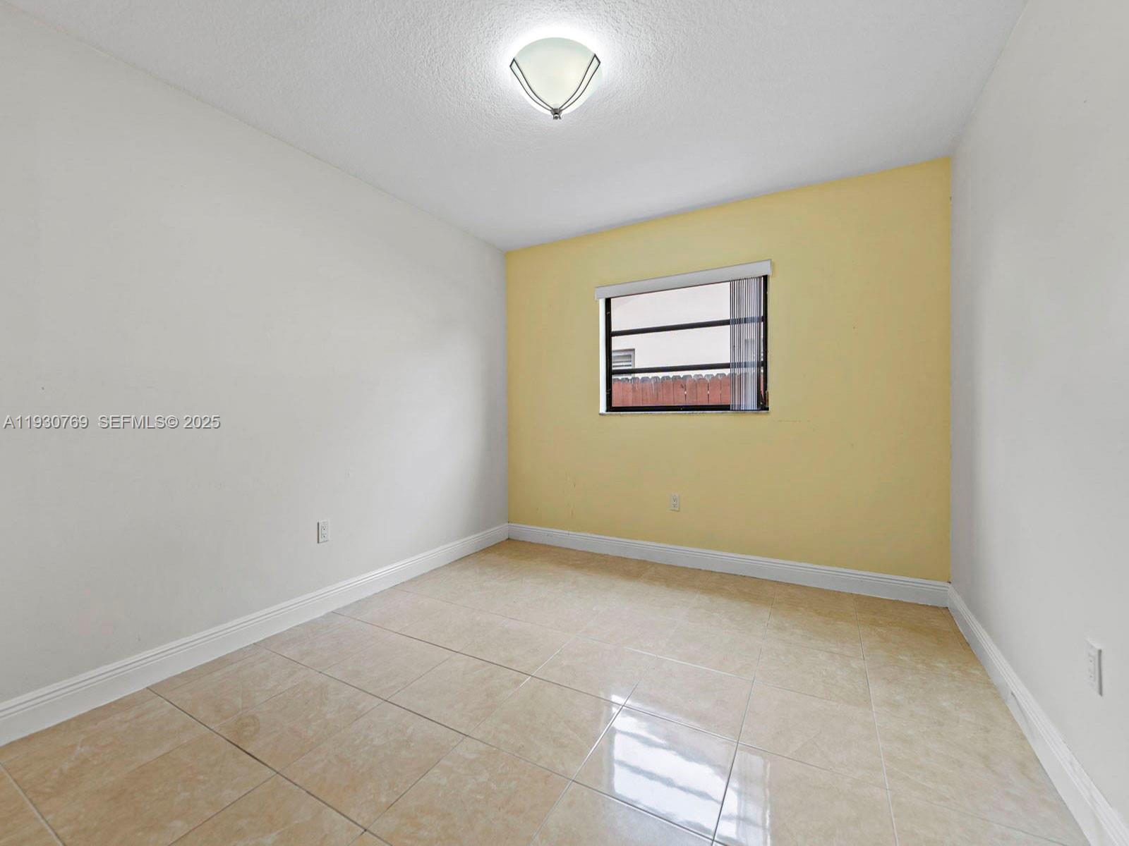 3791 Southwest 142nd Avenue Miami, FL 33175 - Photo 26 of 44 an empty room with a window