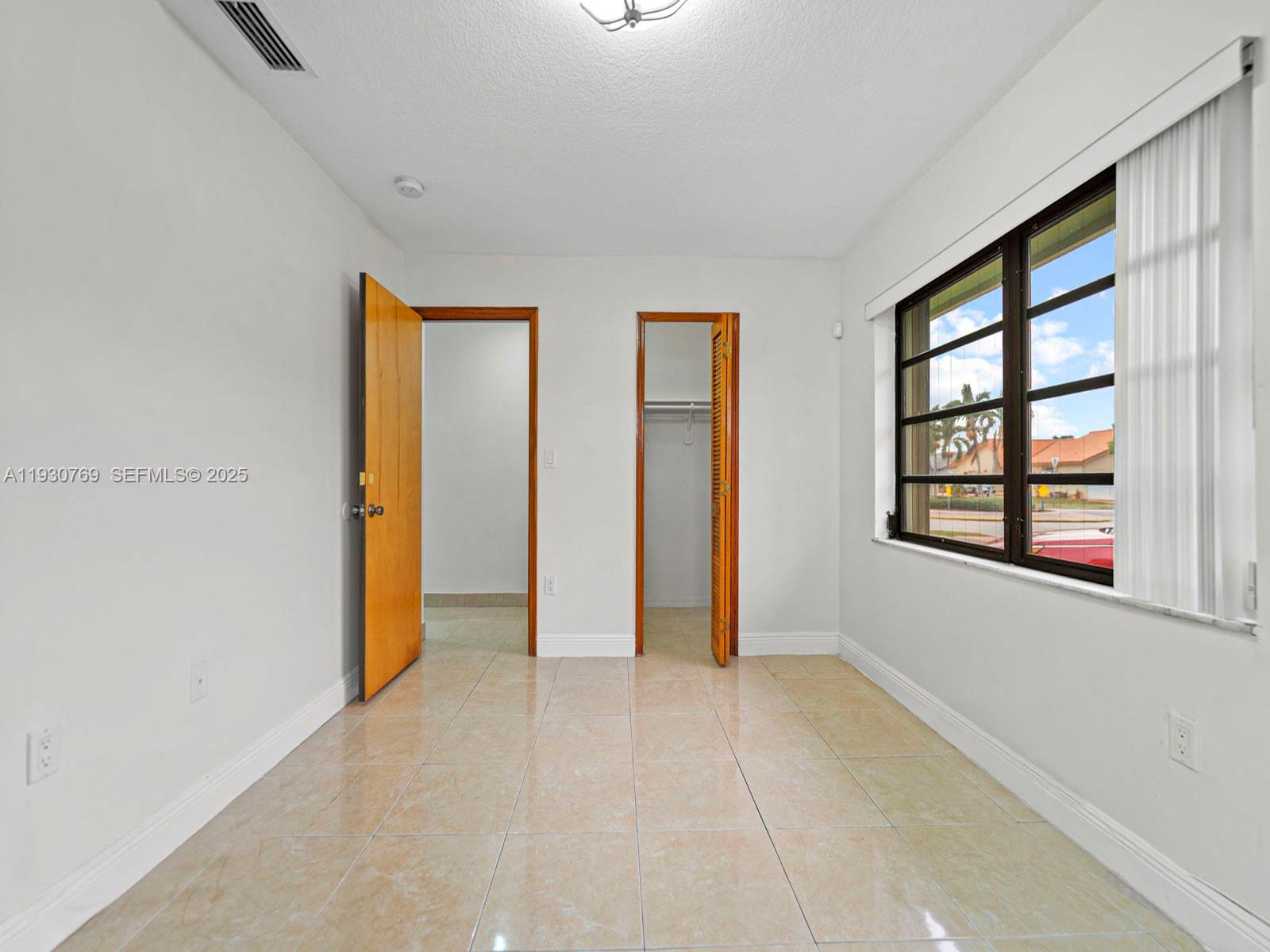 3791 Southwest 142nd Avenue Miami, FL 33175 - Photo 27 of 44 an empty room with windows