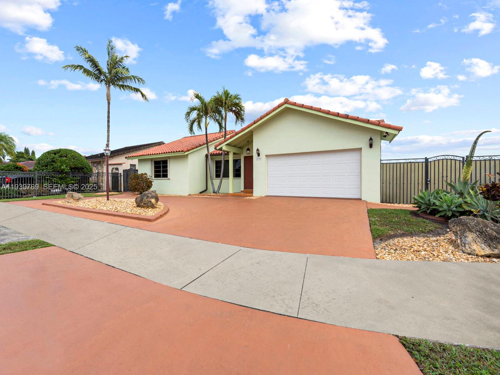3791 Southwest 142nd Avenue Miami, FL 33175 - Photo 4 of 44 a house view with a garden space