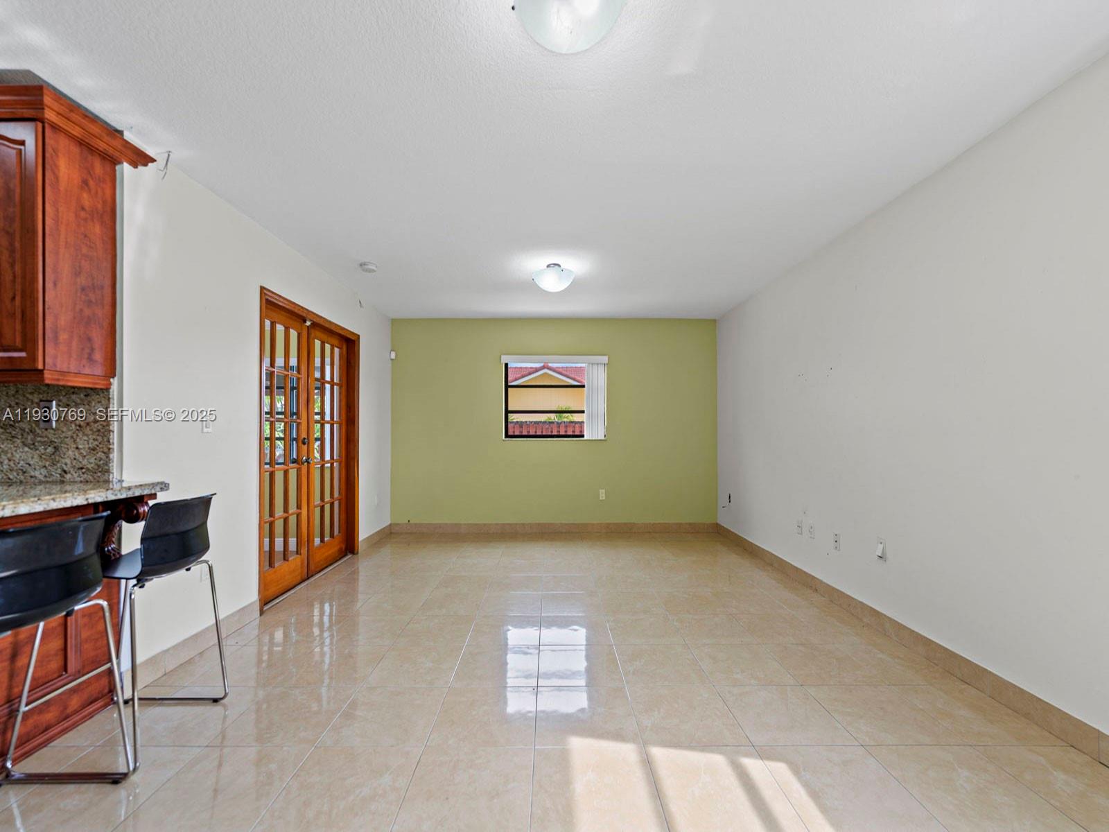 3791 Southwest 142nd Avenue Miami, FL 33175 - Photo 9 of 44 a view of an empty room with a window