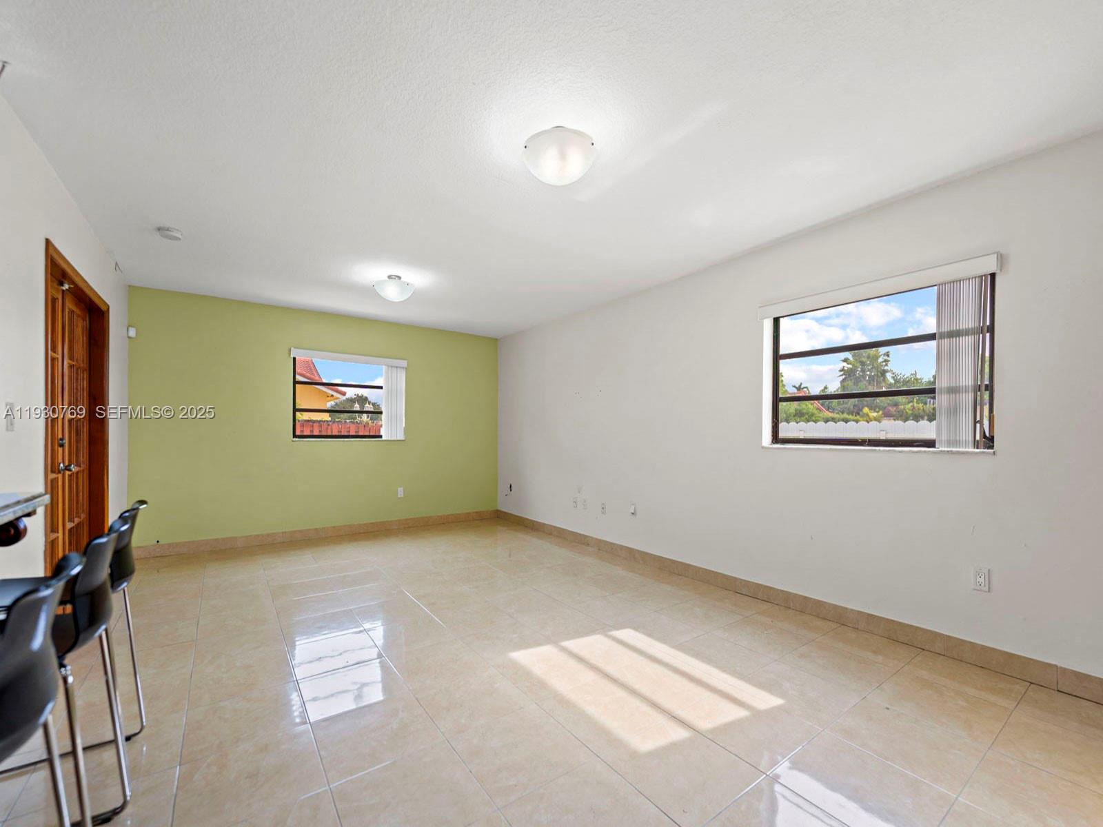 3791 Southwest 142nd Avenue Miami, FL 33175 - Photo 10 of 44 a view of an empty room with a window