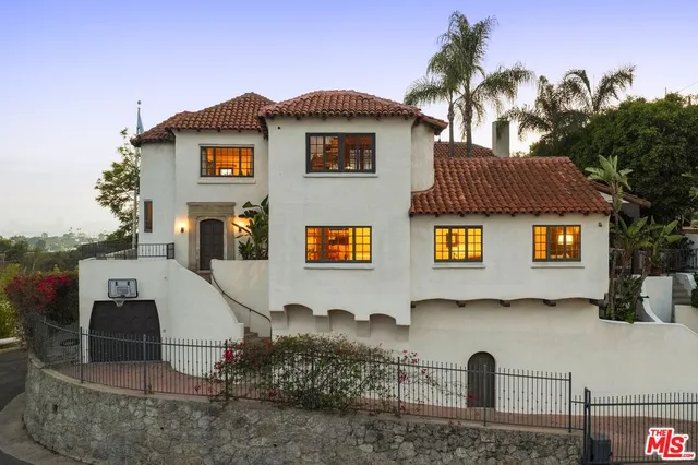 a front view of a house with parking