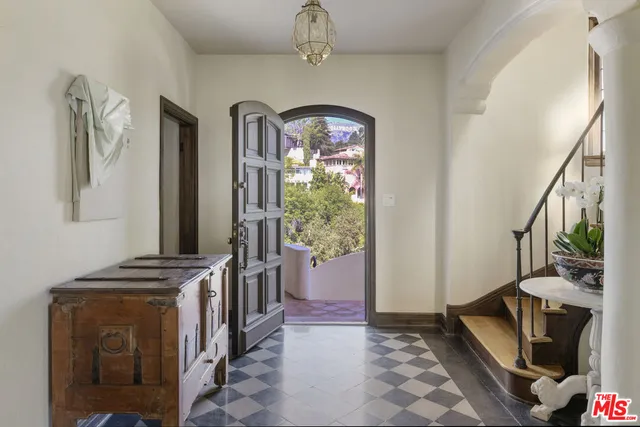 a view of an entryway with wooden floor