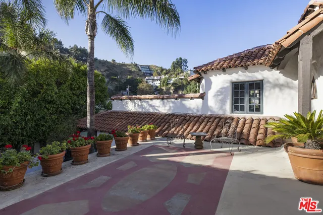 a view of a chairs and table in the patio