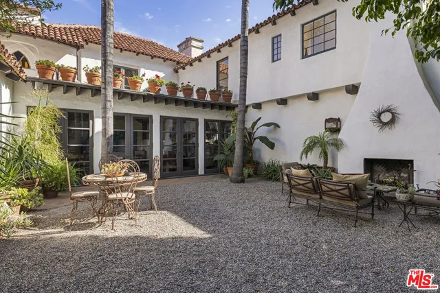 a white bench sitting in front of a building
