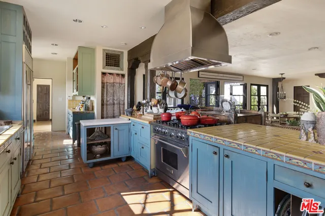 a kitchen with stainless steel appliances granite countertop a sink and cabinets