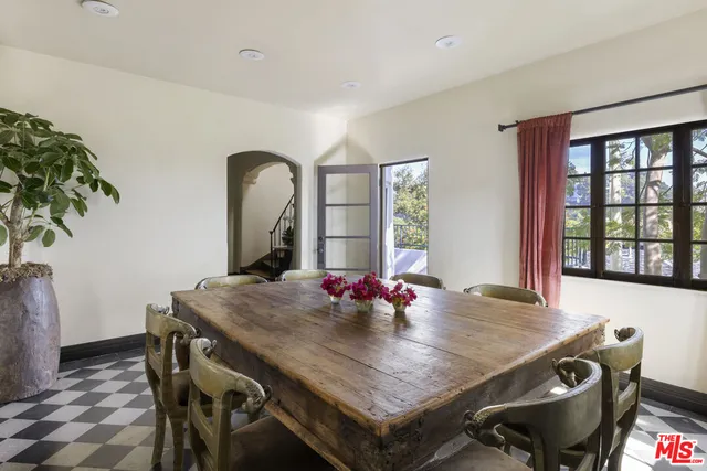 a view of a dining table and chairs in a room