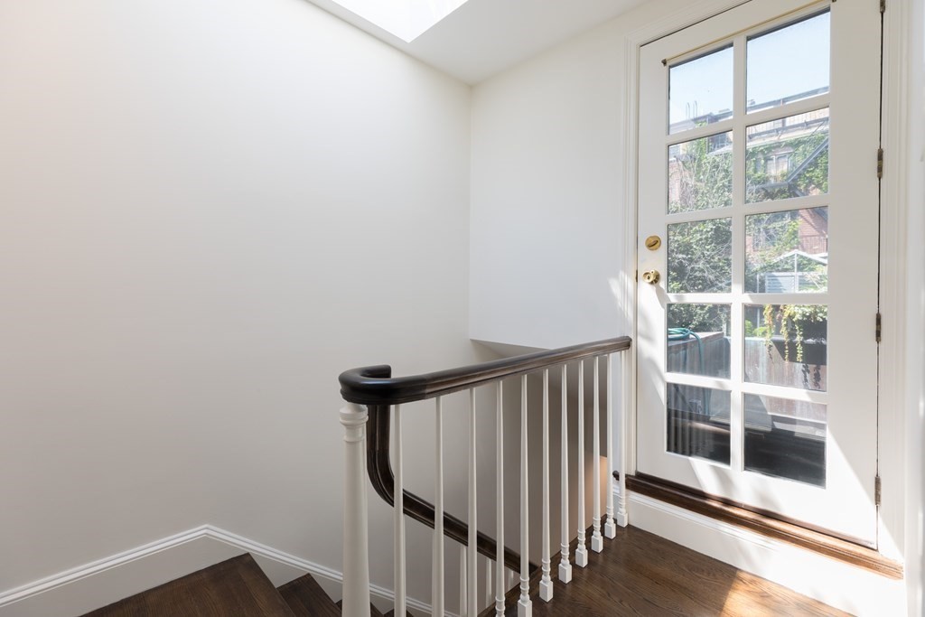 21 Branch Boston Ma Boston, MA 02111 - Photo 10 of 24 a view of a hallway with wooden floor and windows