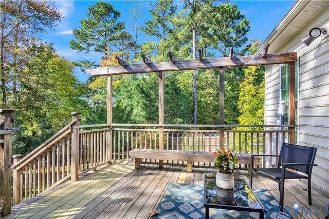 a view of a patio with table and chairs and potted plants