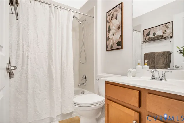 a living room with furniture and a book shelf