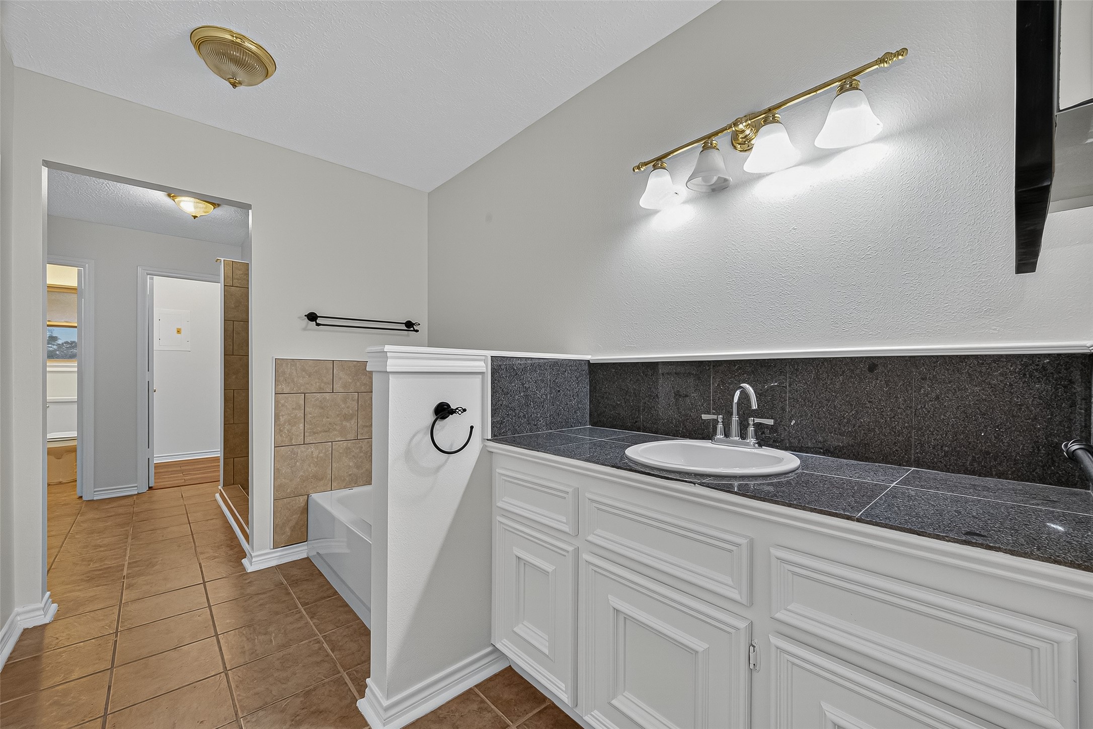 3122 Kueck Road Rosenberg, TX 77471 - Photo 16 of 25 a spacious bathroom with a sink and a mirror