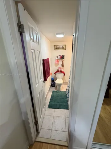 a kitchen with a cabinets and white appliances