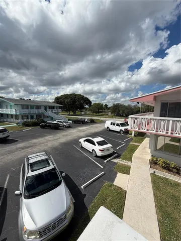 a view of a city street with cars
