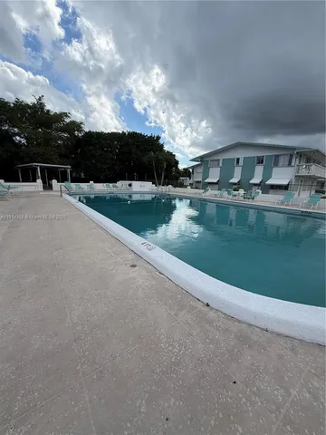 a view of a lake with a yard