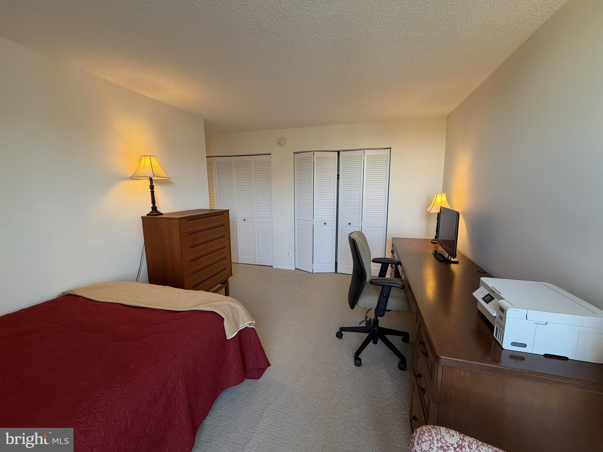 6800 Fleetwood Road, Unit 1002 McLean, VA 22101 - Photo 14 of 22 a bedroom with a bed and a desk