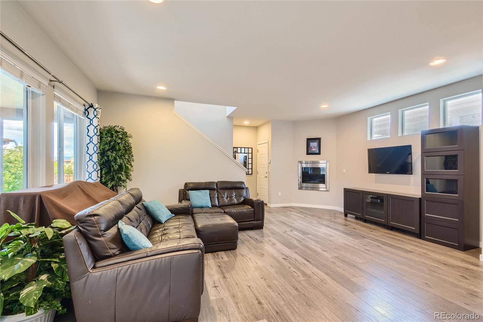 3319 Cranston Circle Highlands Ranch, CO 80126 - Photo 11 of 28 a living room with furniture and a flat screen tv