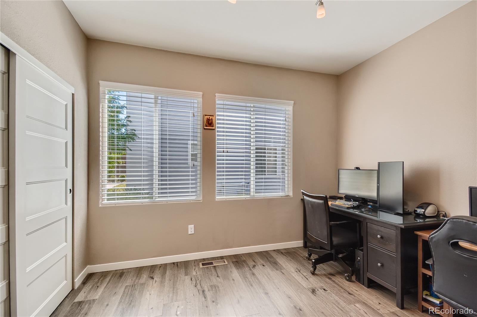 3319 Cranston Circle Highlands Ranch, CO 80126 - Photo 13 of 28 a view of a workspace with furniture and a window